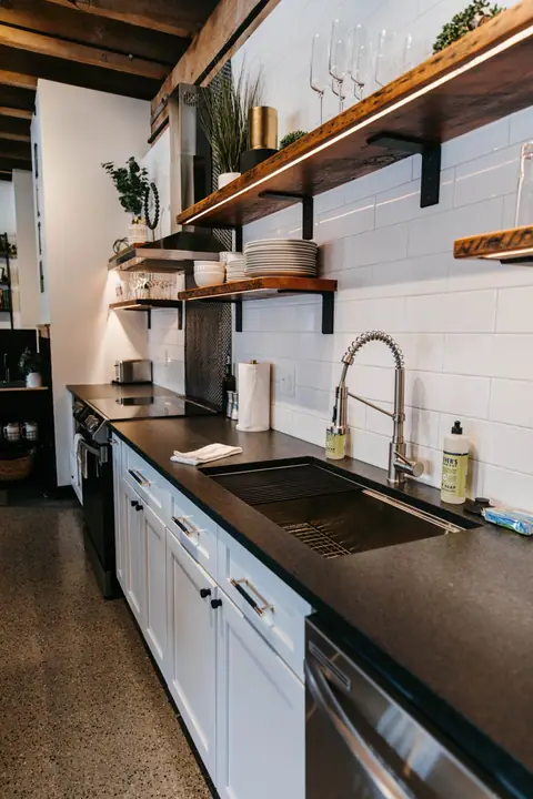 A bright Brix condo kitchen with open shelves and a coffee setup in Canal Park, Duluth